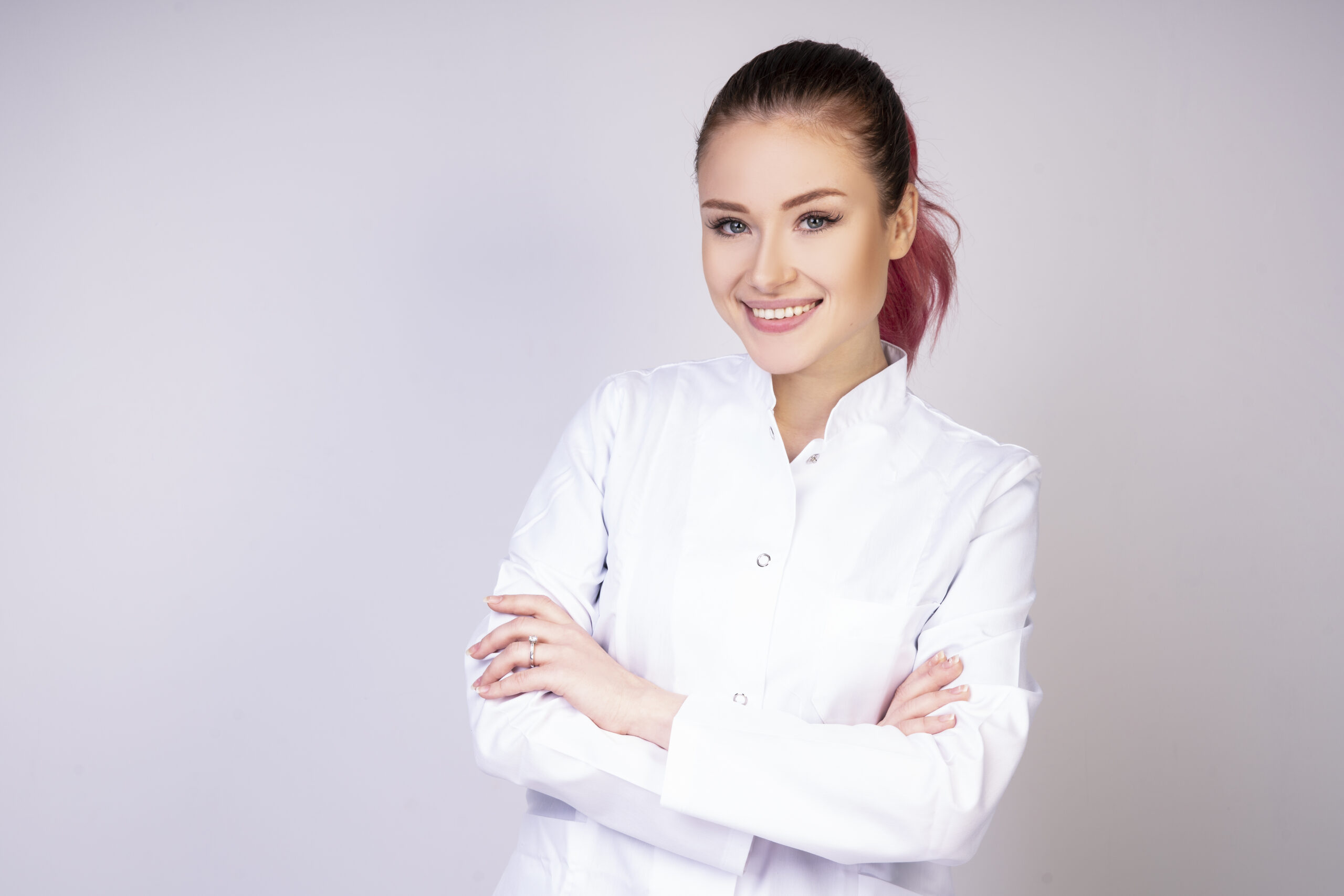 smiling girl in white doctor uniform _
